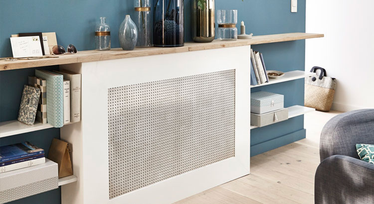 Radiateur camouflé dans un coffret avec grille d'aération